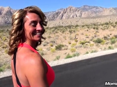 Outdoor solo masturbation scene with curly blonde